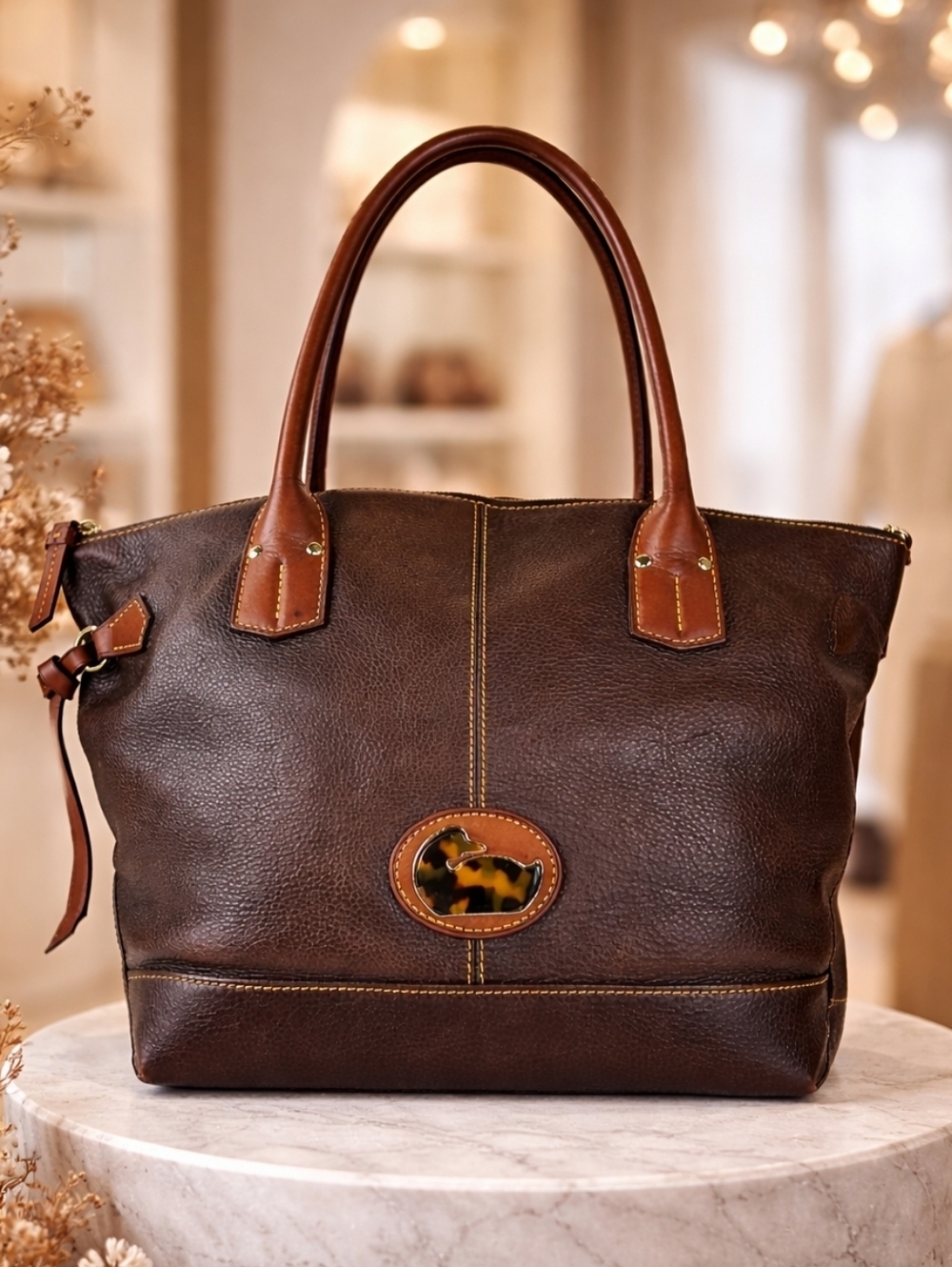 Dooney & Bourke Brown Pebbled Leather Tote with Duck Logo